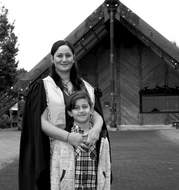 Tineka Bartlett and her son in front of marae